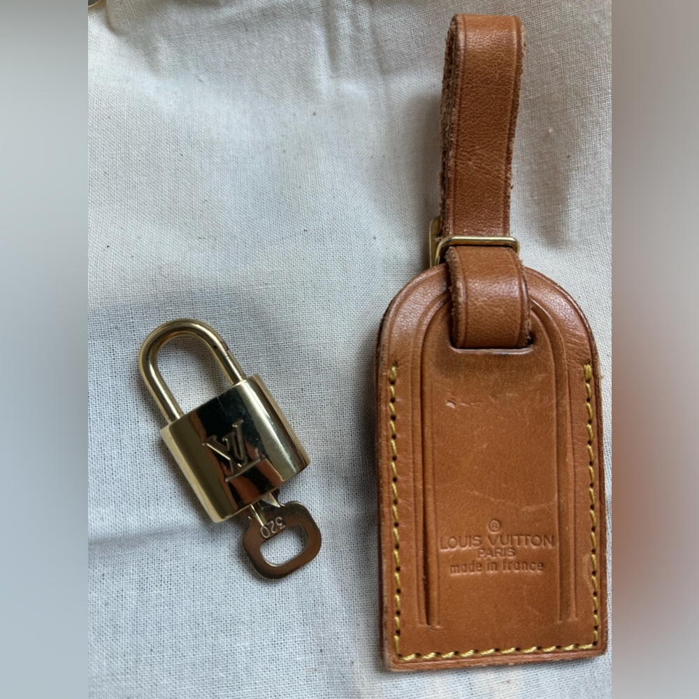 Louis Vuitton lock and key, and tag bundle.